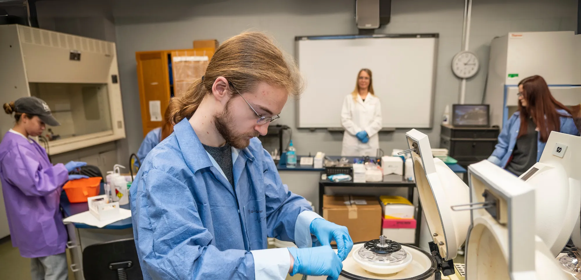 AState Students Running Labs in class while professor gives lesson.