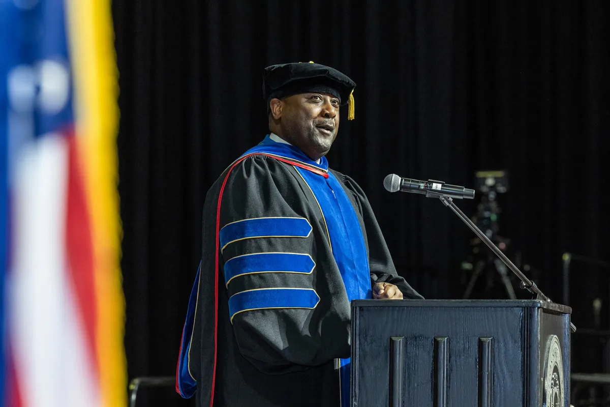 Dr. Calvin White looks out over the crowd at a recent commencement ceremony