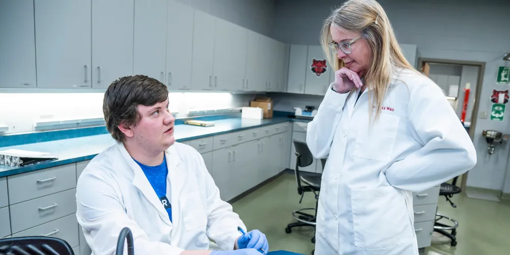 Dr. Walz teaching blood transfusion labs with students.