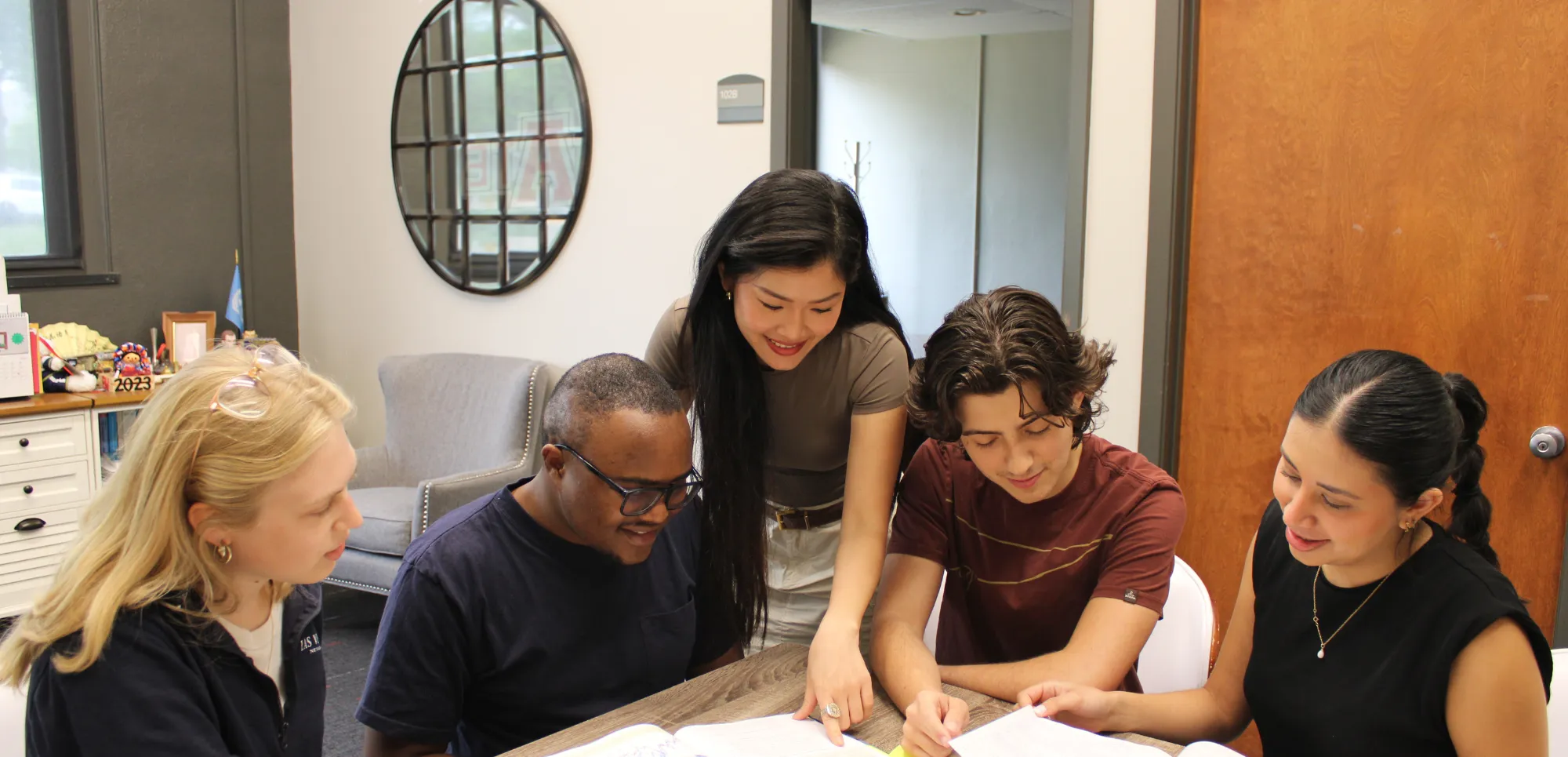 Business student thinking while stroking beard.
