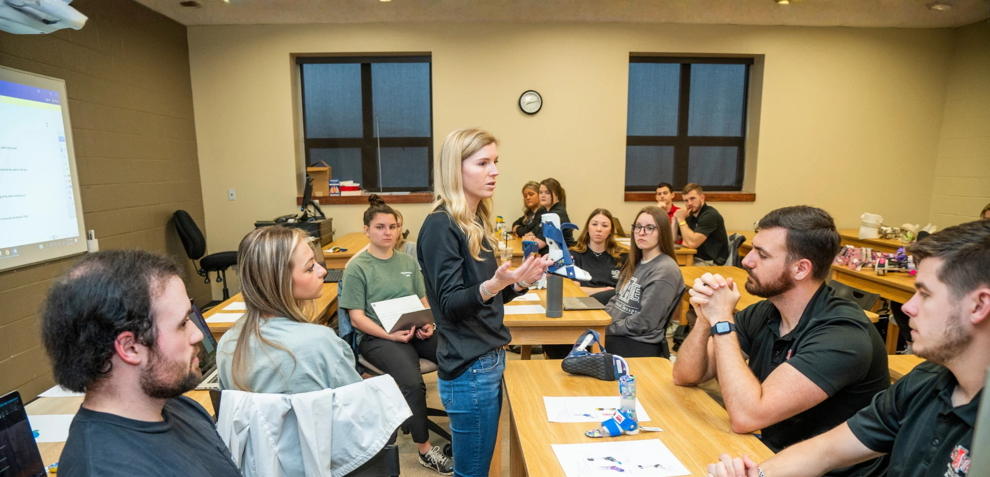 Dr. Rachel Wilkins teaching DPT students in the classroom.