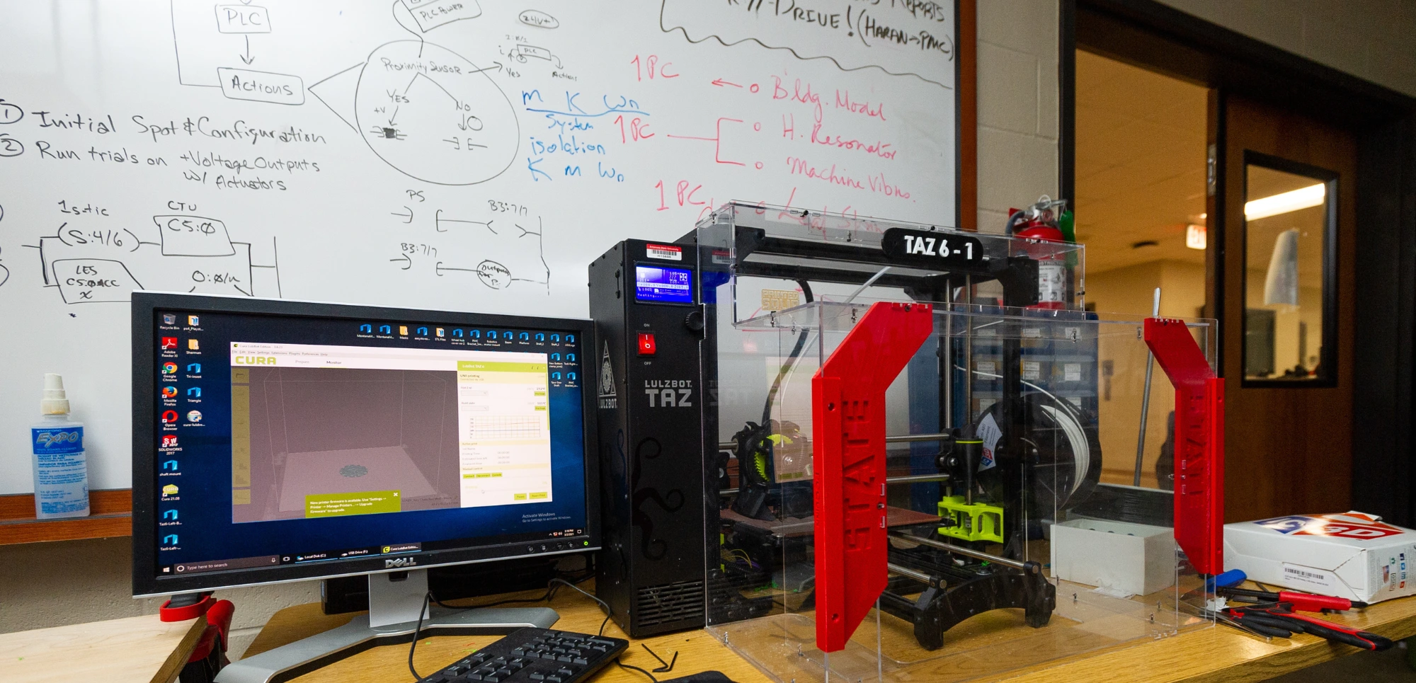 A-State Mechanical Engineering lab with a 3D printer branded with the red wolves logo.