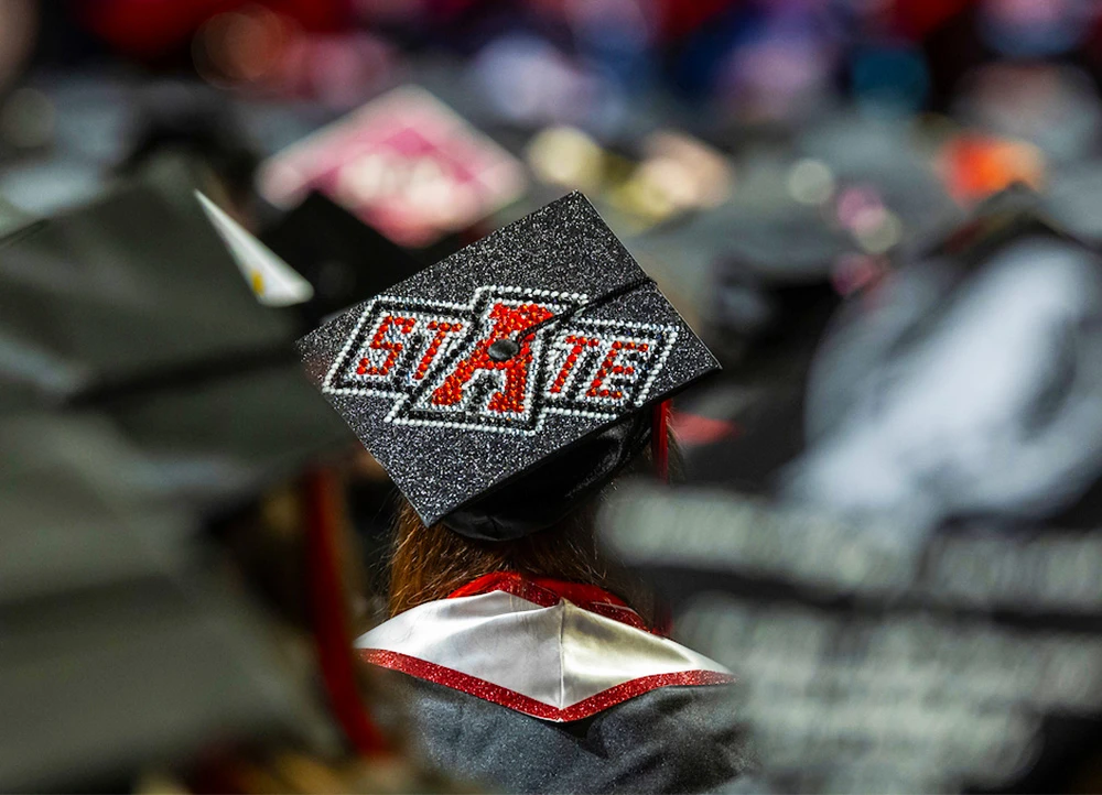 mortar board with A-State logo at commencement