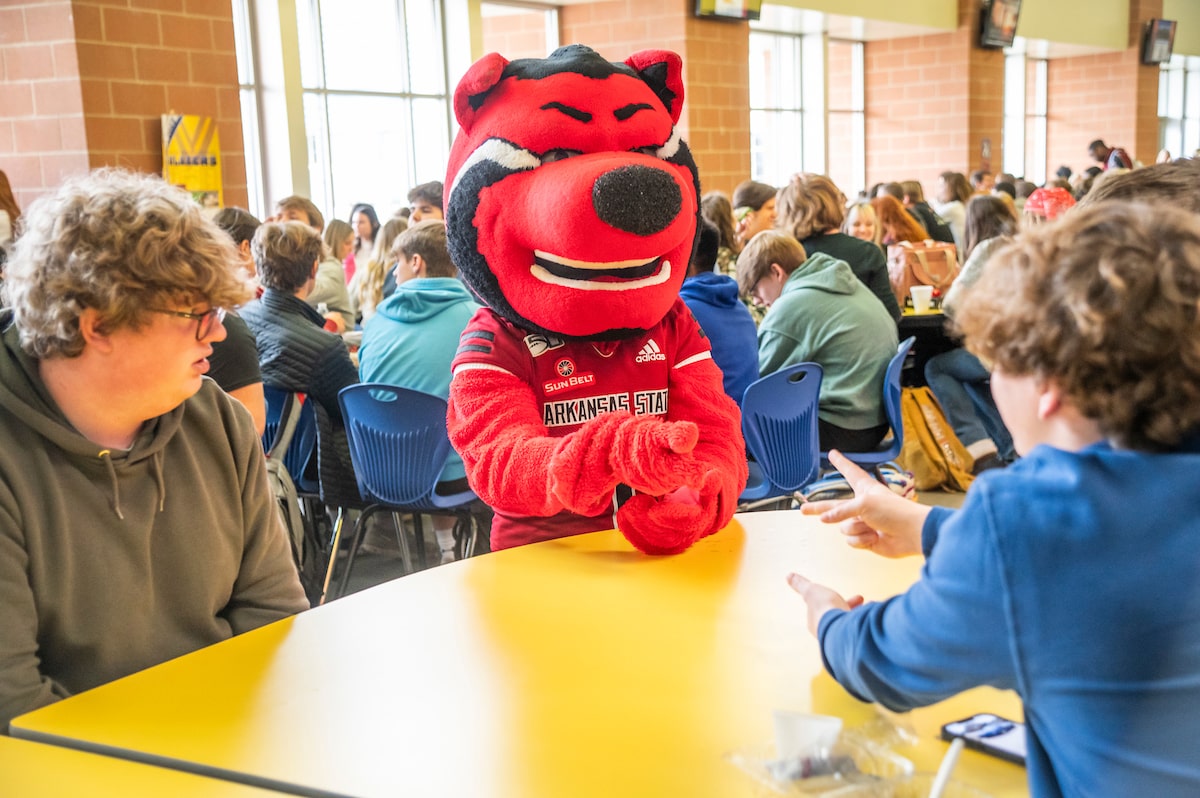A-State’s mascot, Howl, hanging out in a local high school cafeteria.