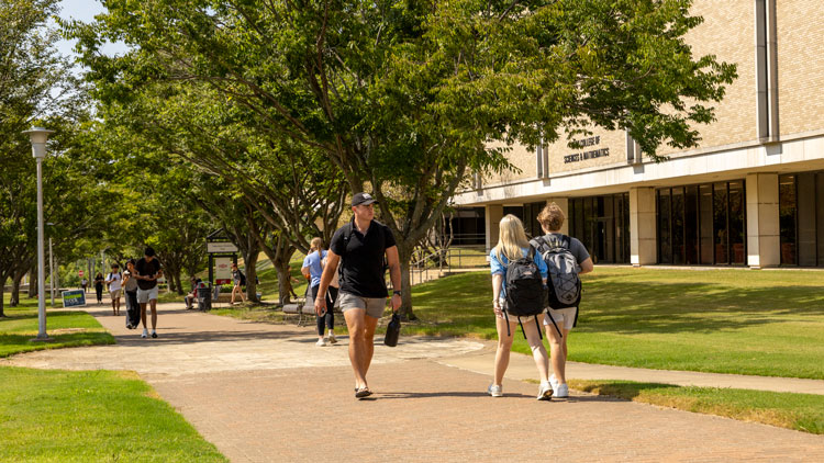 students walking on campus 