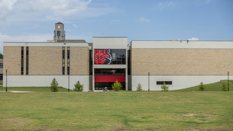 buidling with red wolf logo. 