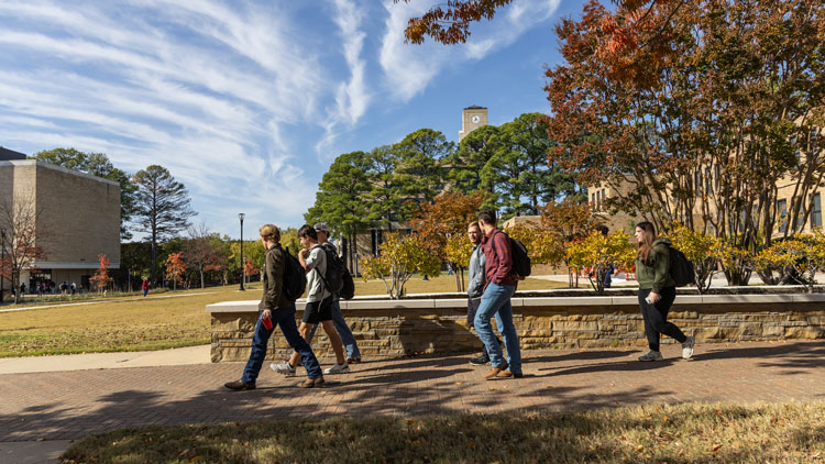 students walking on campus 