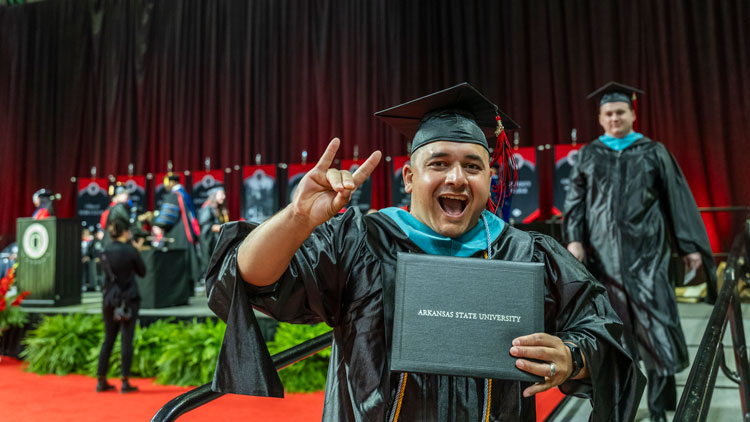 A-State graduate during a previous university commencement exercise. 