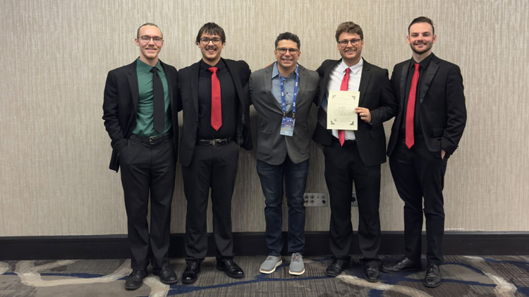 From left to right, Kenzik, Dawes, Dr. Simoes, Kibble and Hayungs at the competition. 