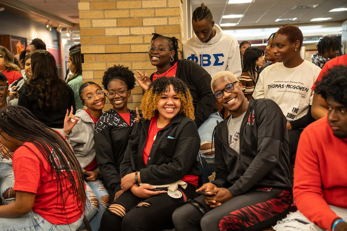 A group of NPHC members pose for a photo at an event in the student union.
