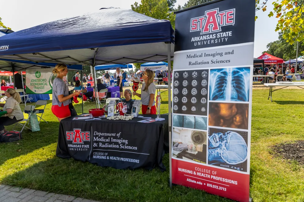 Nursing and Health Profession students walking on campus.