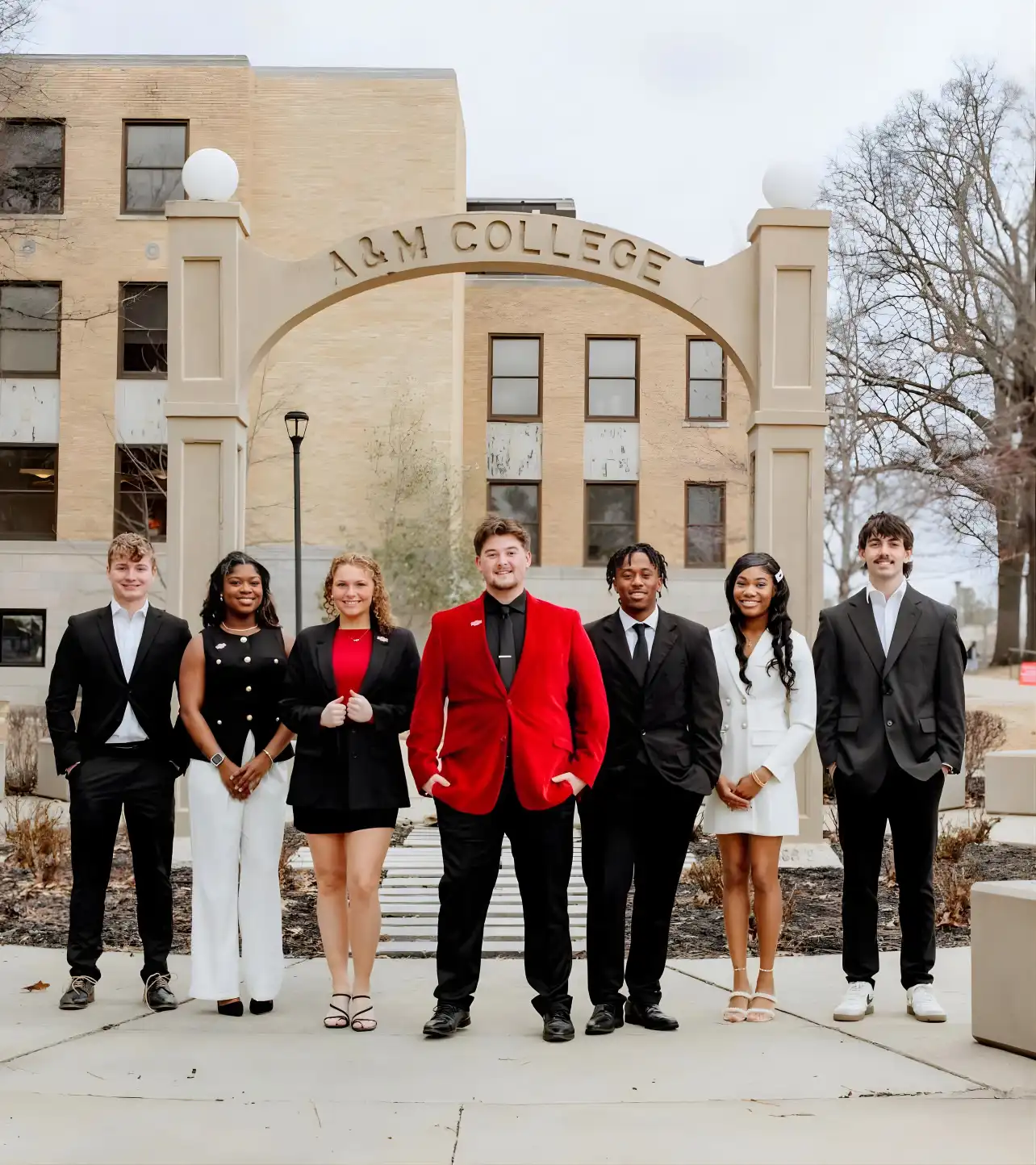 Student Government Association students pose under Memorial Arch.