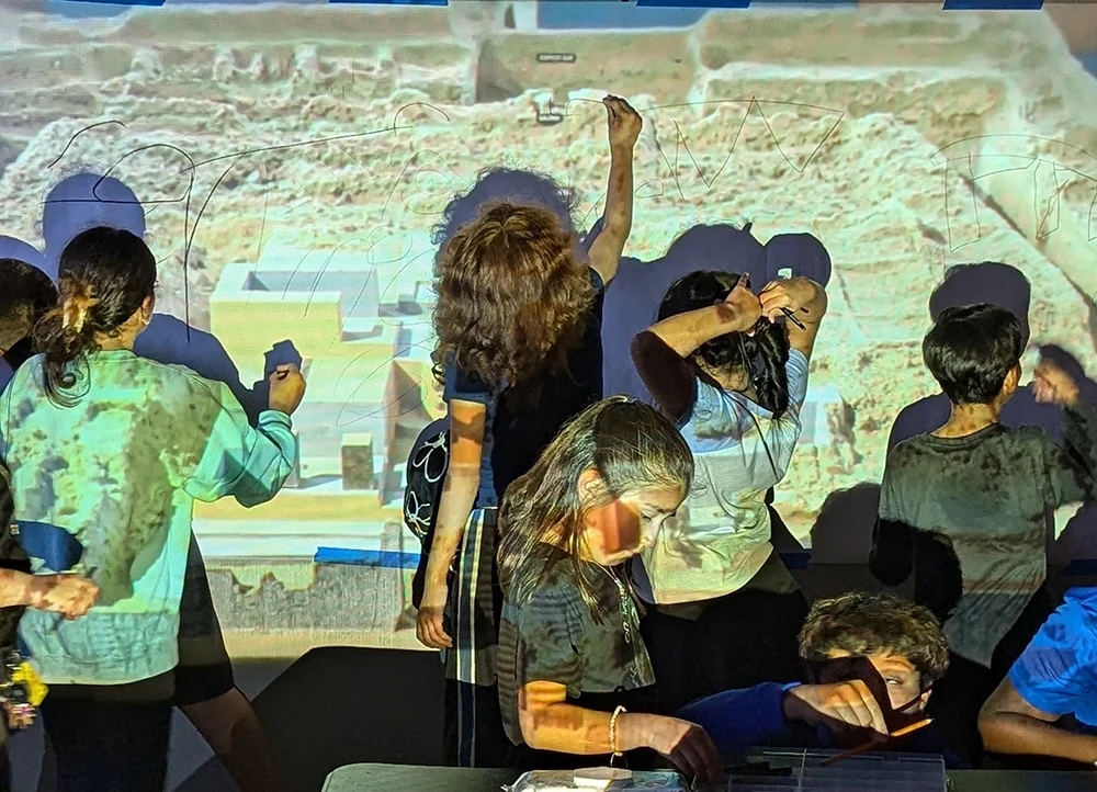 El Centro Hispano afterschool program children participating in interactive exhibition.
